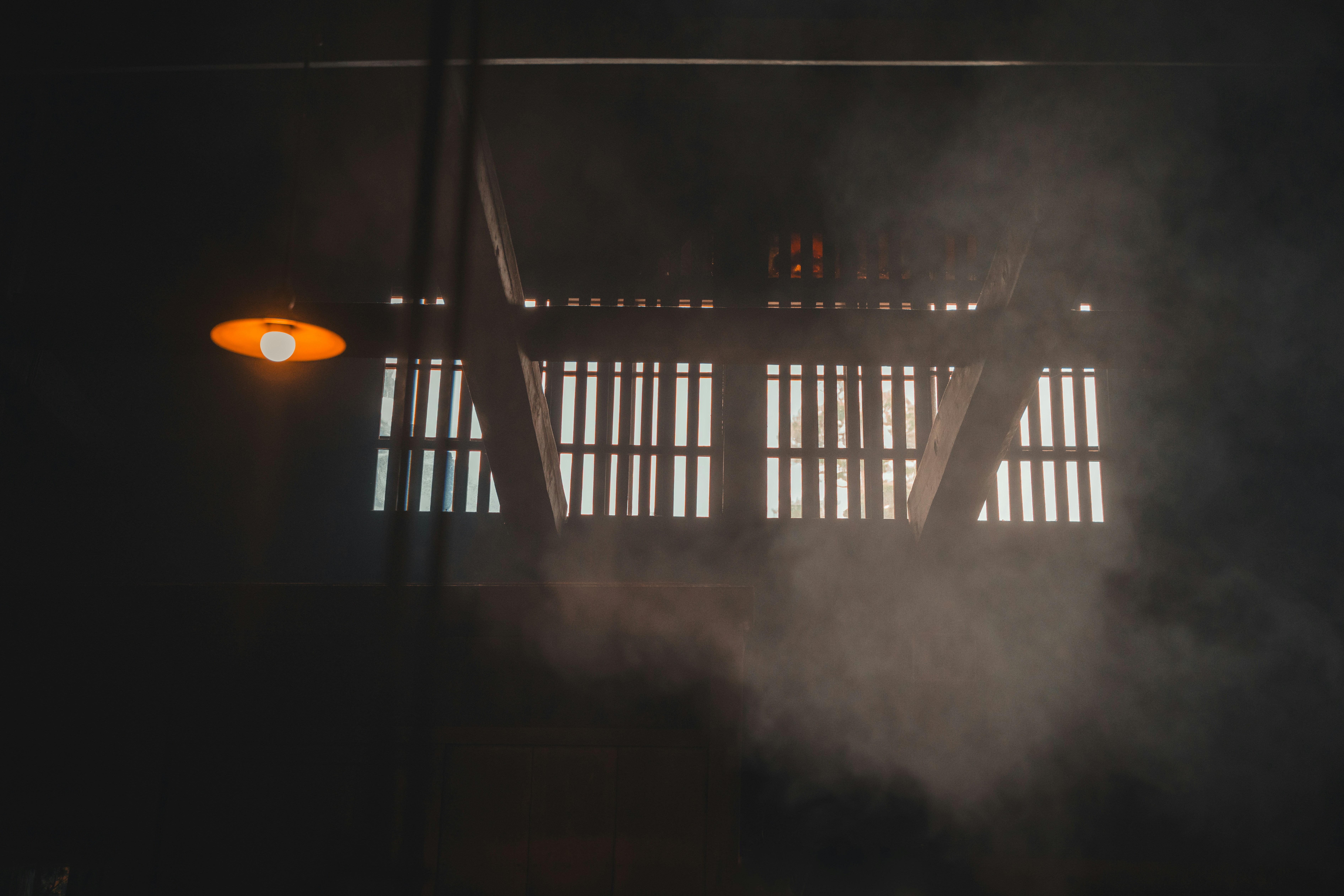 Smoke coming out of a window in the dark