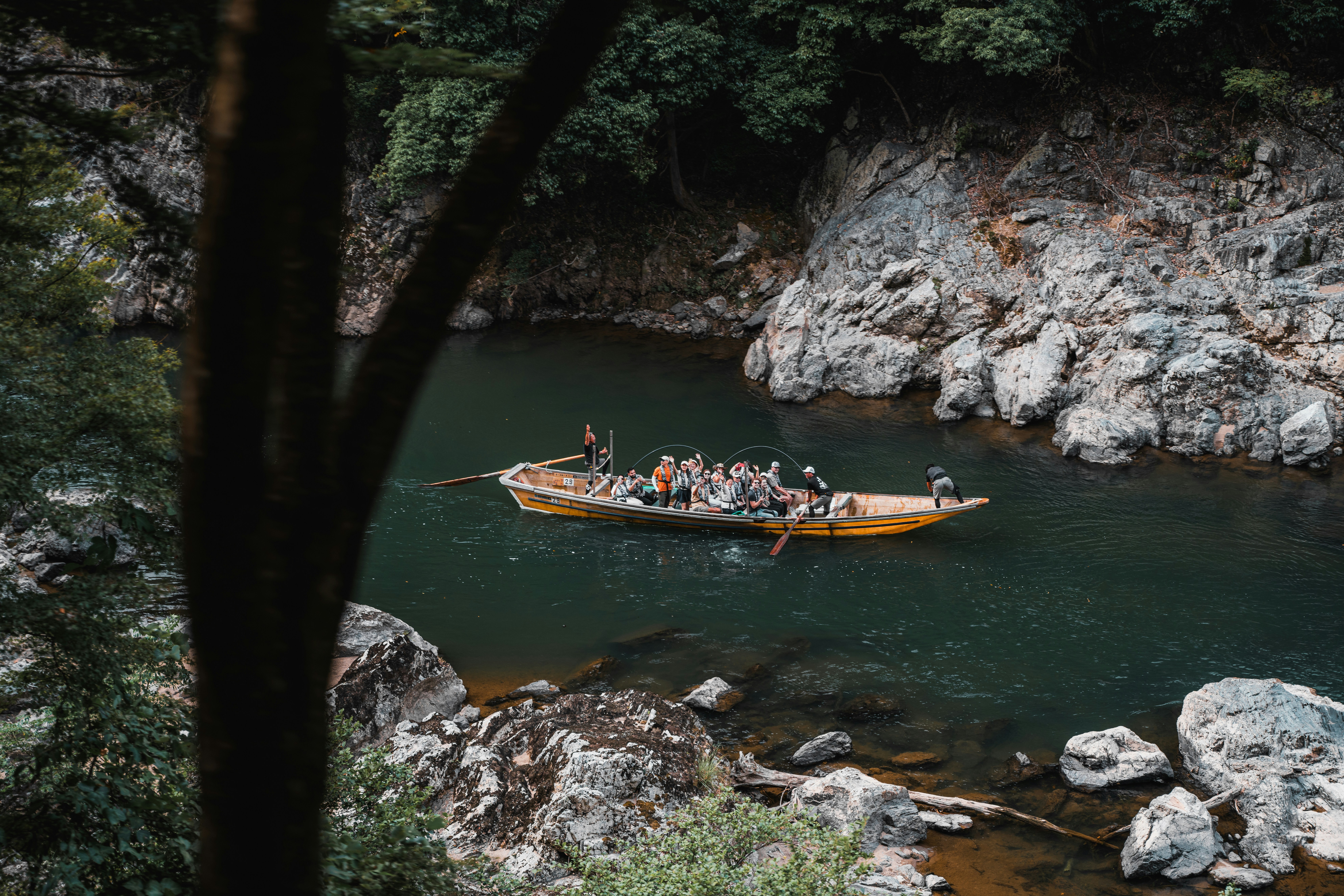 A group of people in a boat on a river