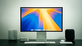 A computer monitor sitting on top of a desk