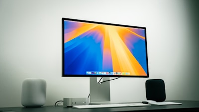 A computer monitor sitting on top of a desk