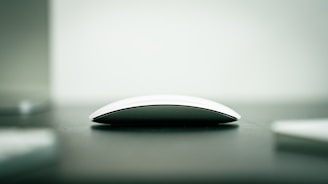 A computer mouse sitting on top of a table