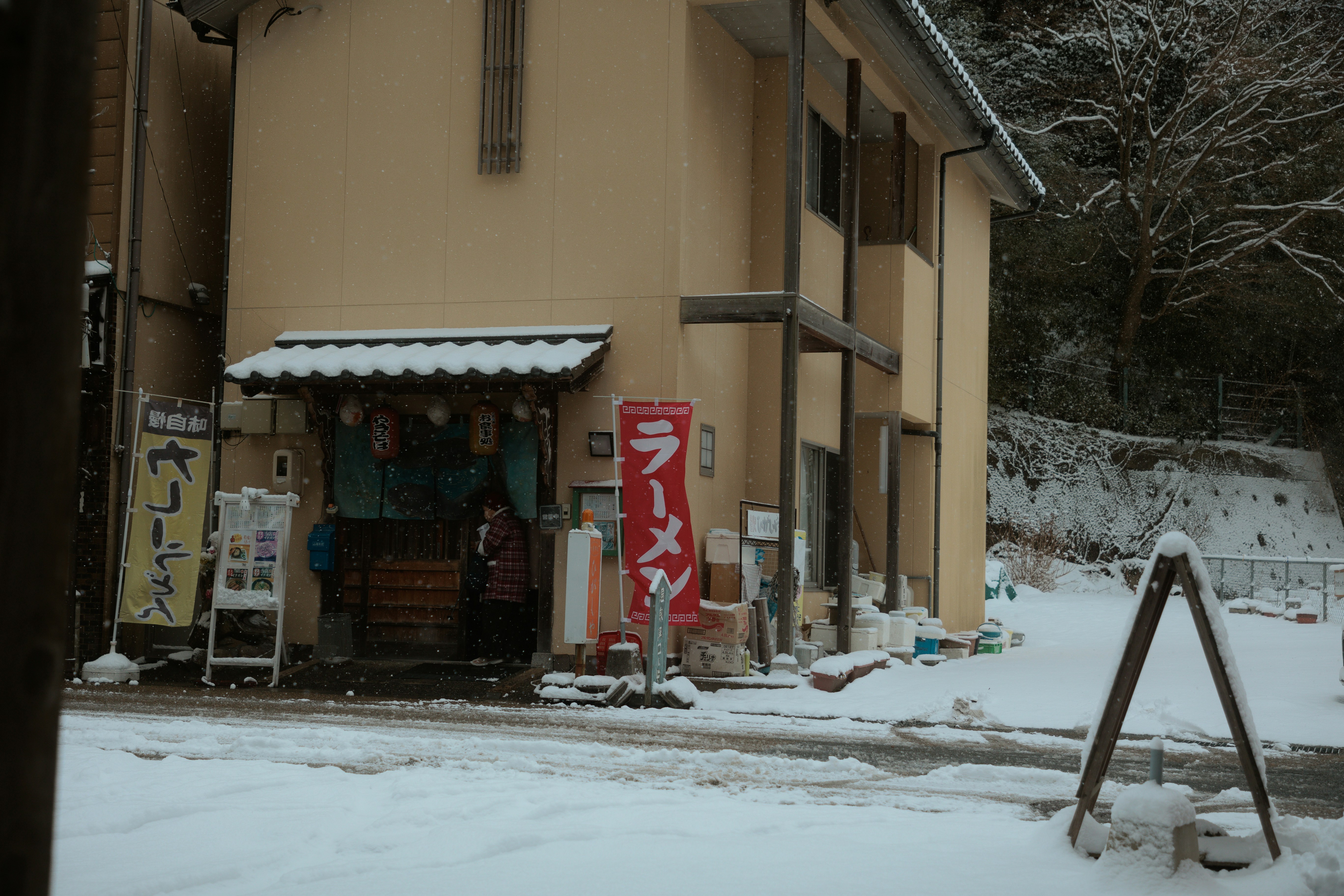 person trying on ski boots in a rental shop