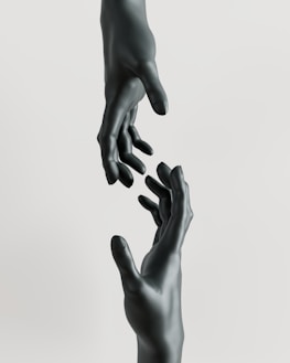A couple of hands reaching for each other