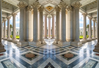 A large room with columns and a sky background