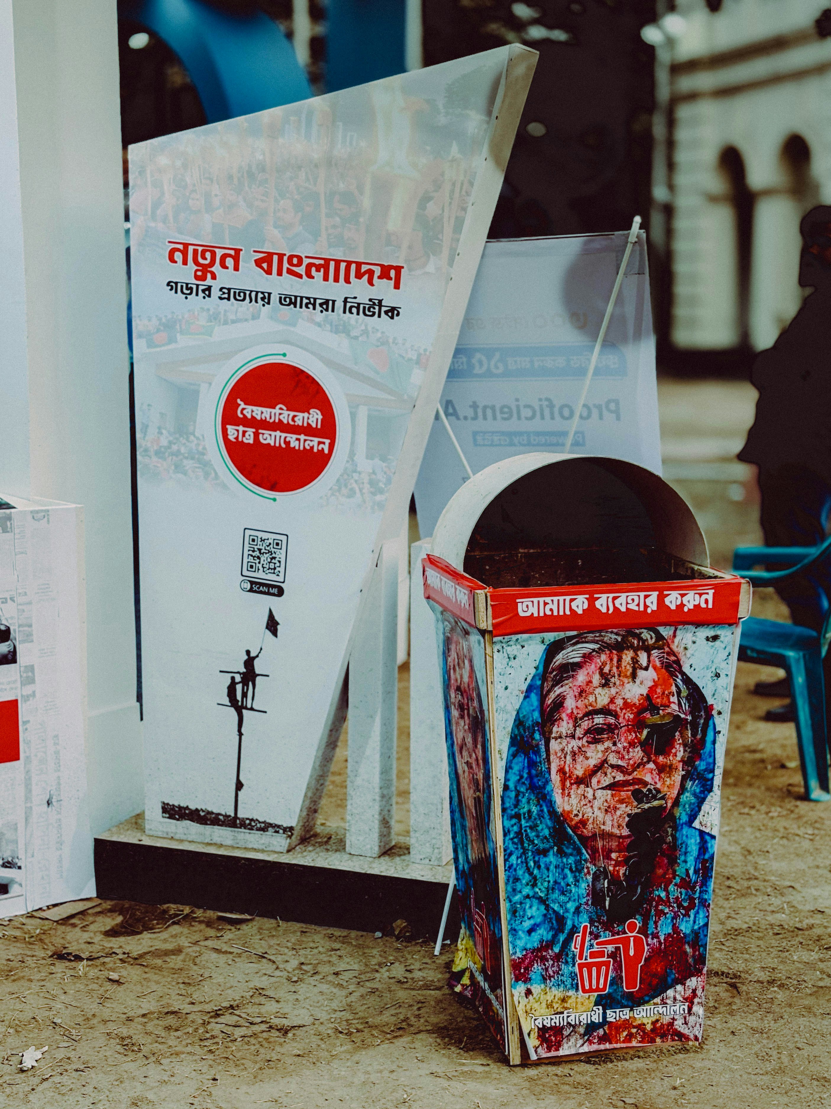 A newspaper dispenser sitting on the side of a street