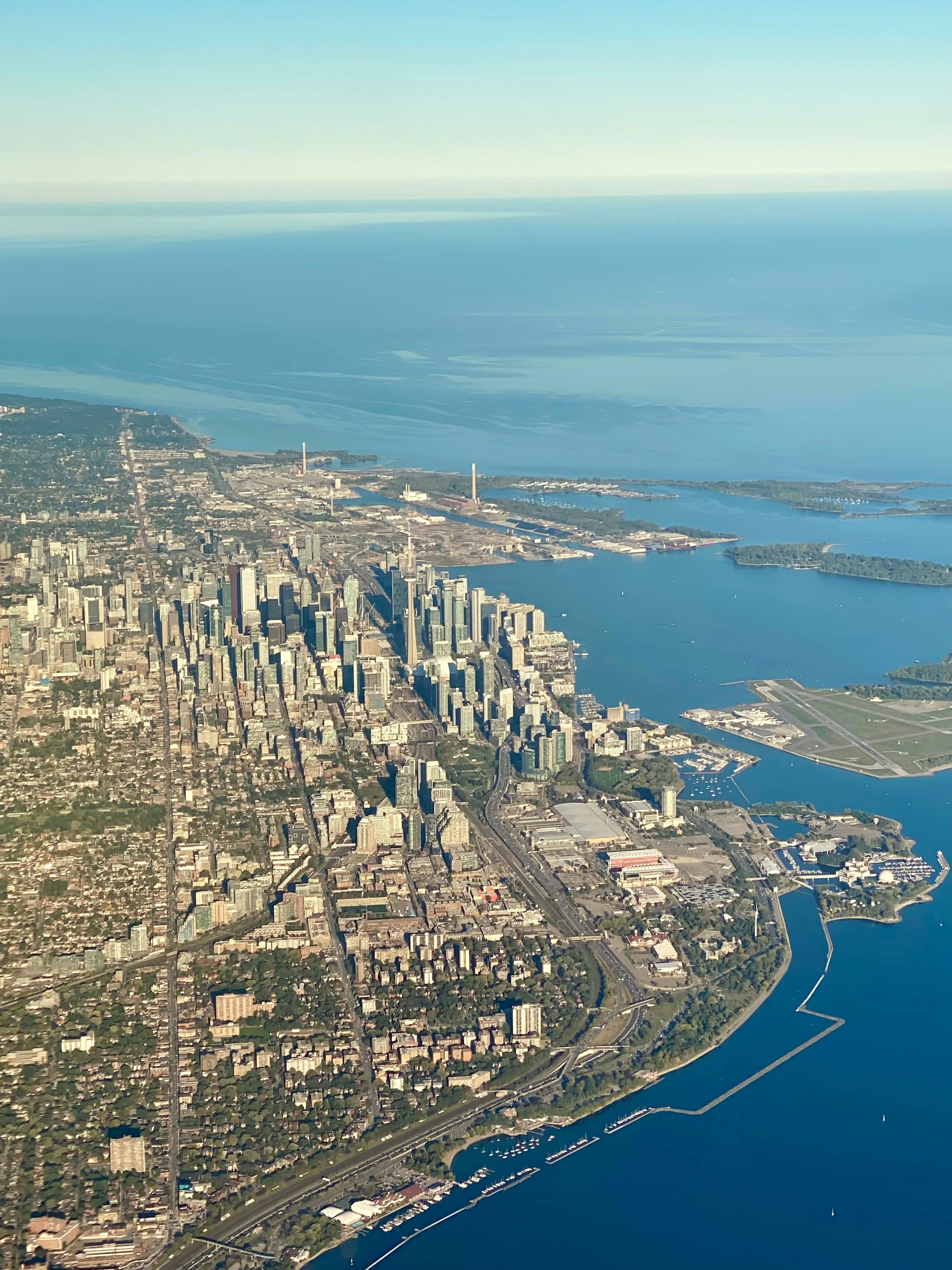 An aerial view of a city and a body of water