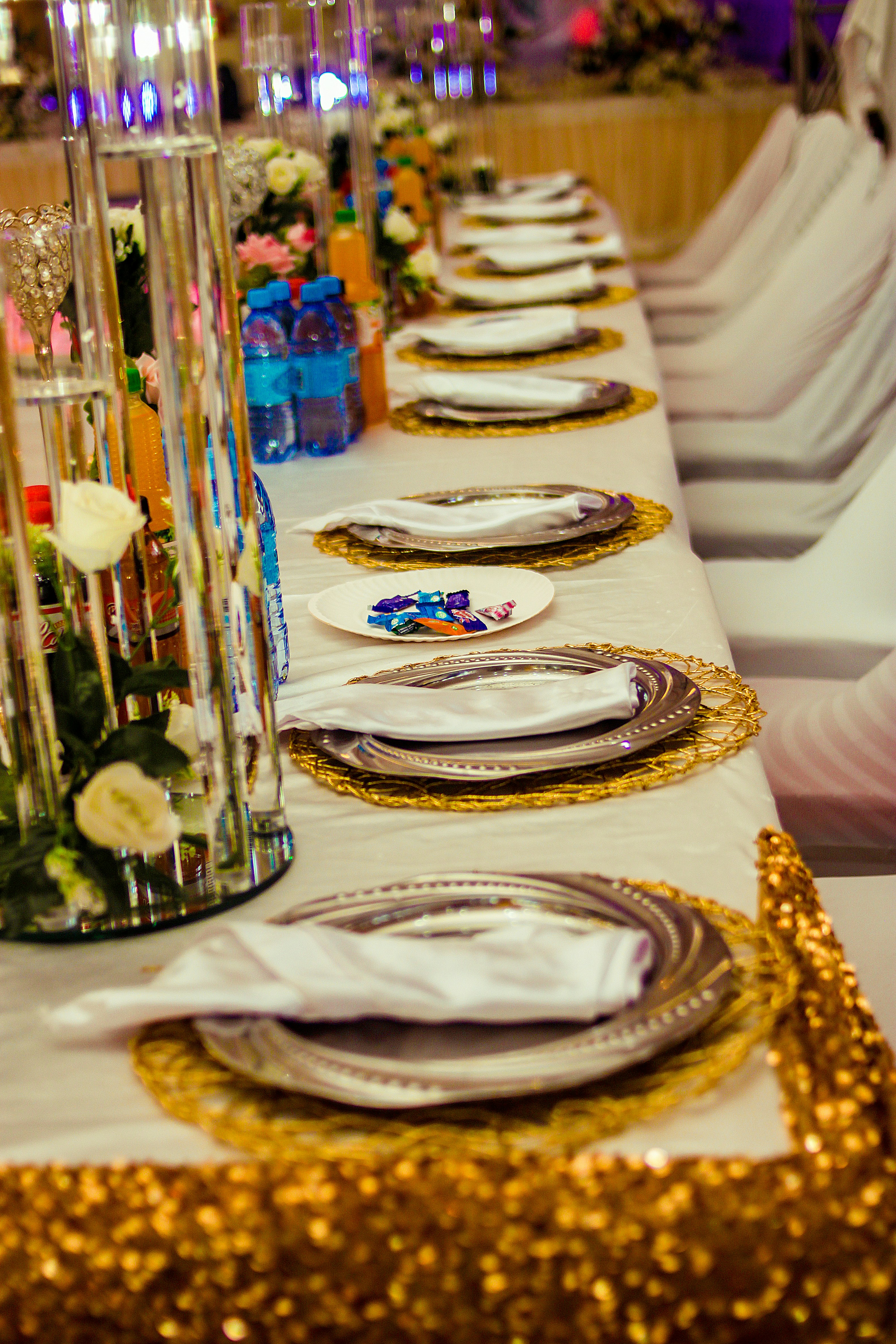 A long table is set with gold sequins