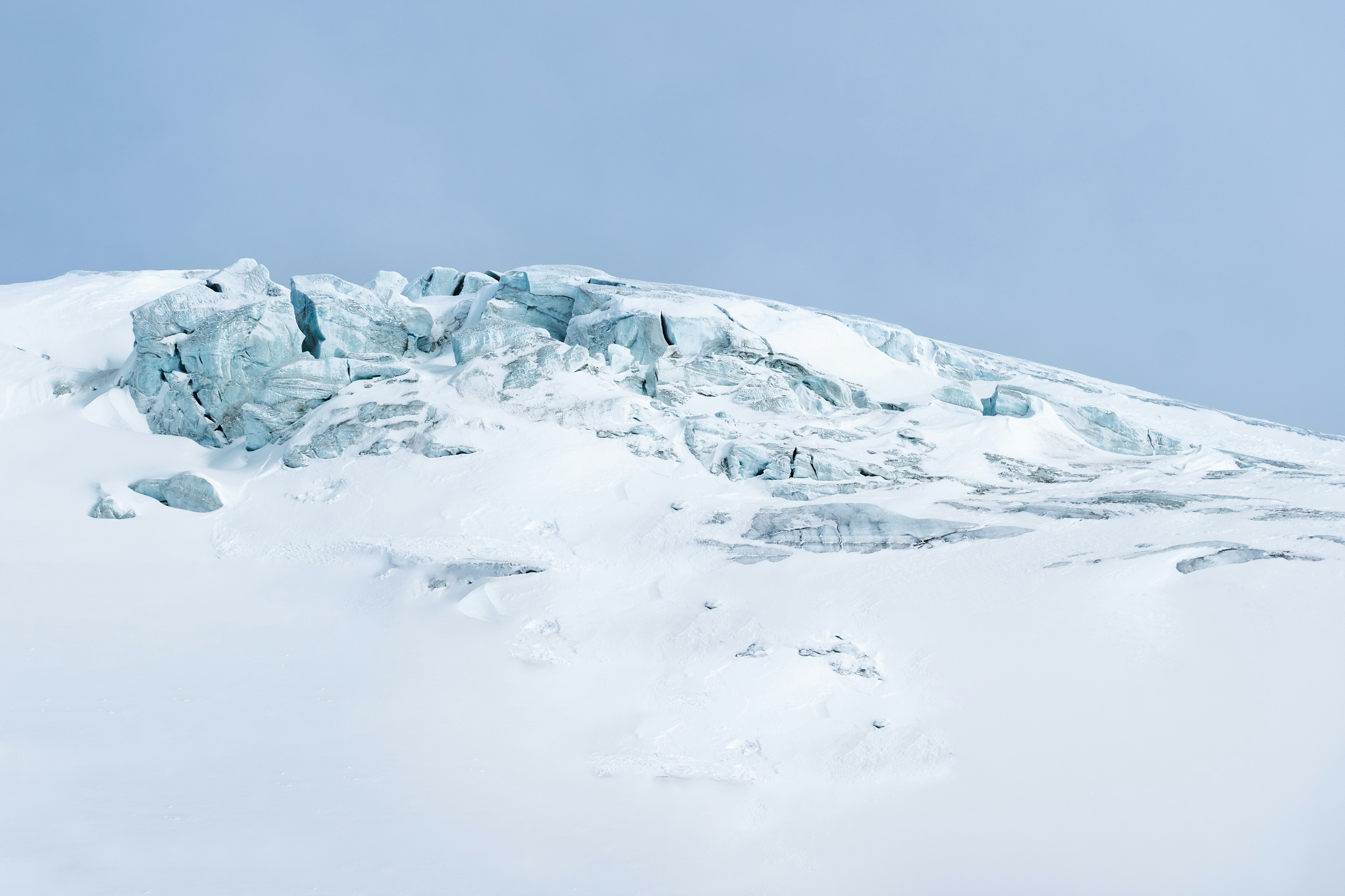 A man riding skis on top of a snow covered slope