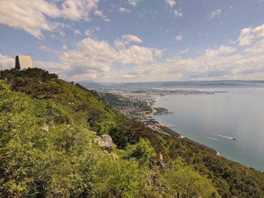 A scenic view of a body of water from a hill — Trieste, Italy
