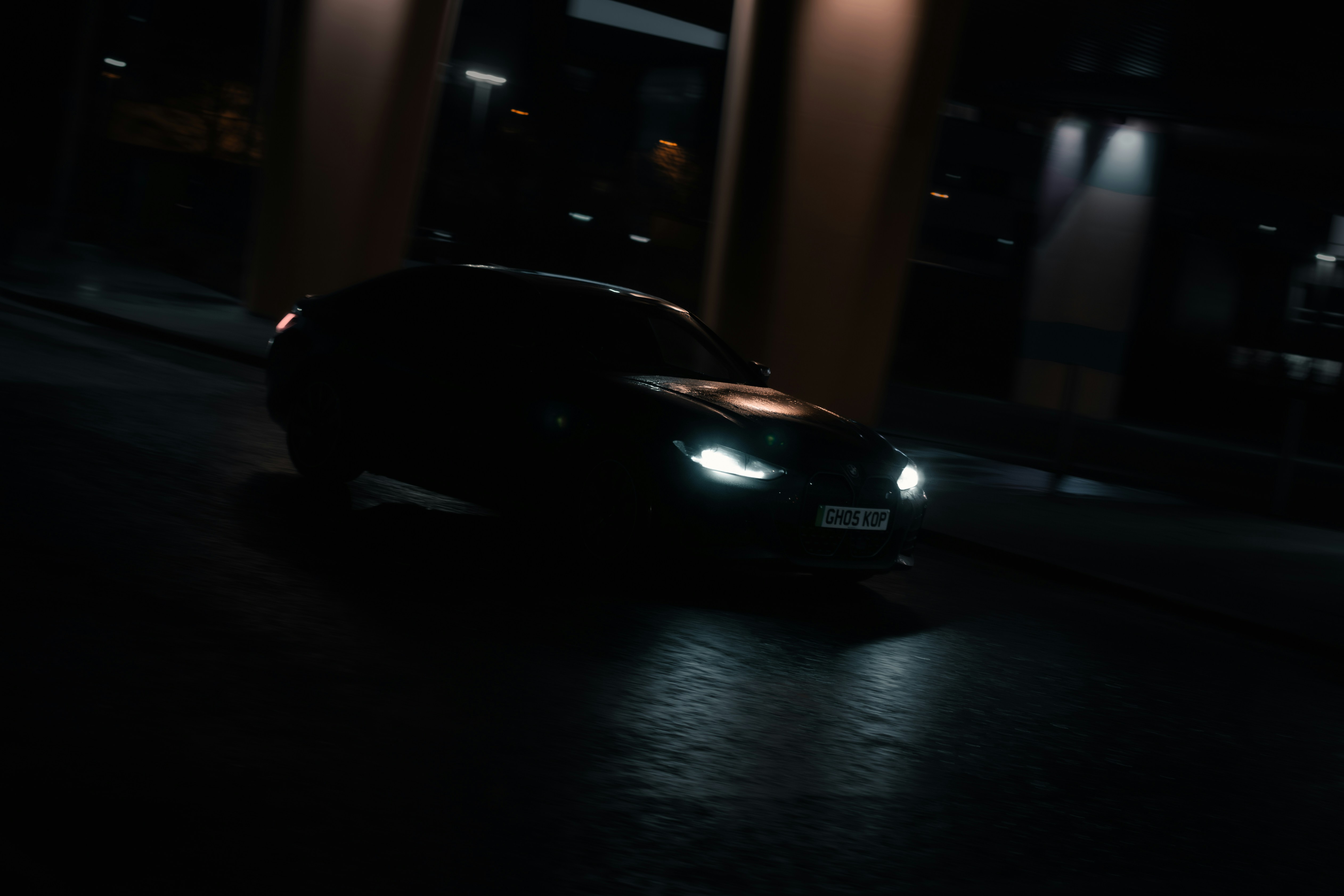 Lexus RZ electric SUV parked near a charging station