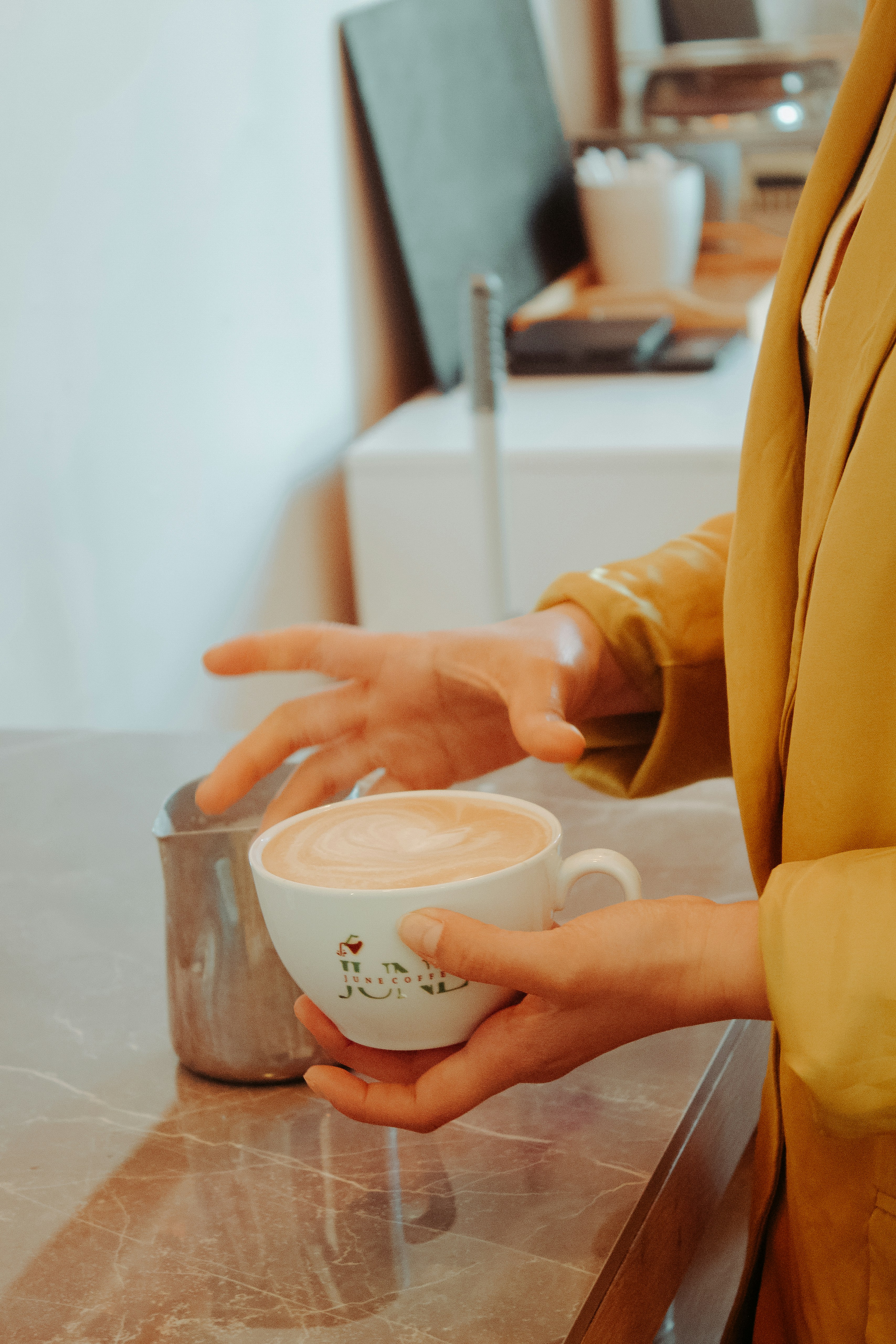 A woman is holding a cup of coffee photo – Free Coffee Image on Unsplash