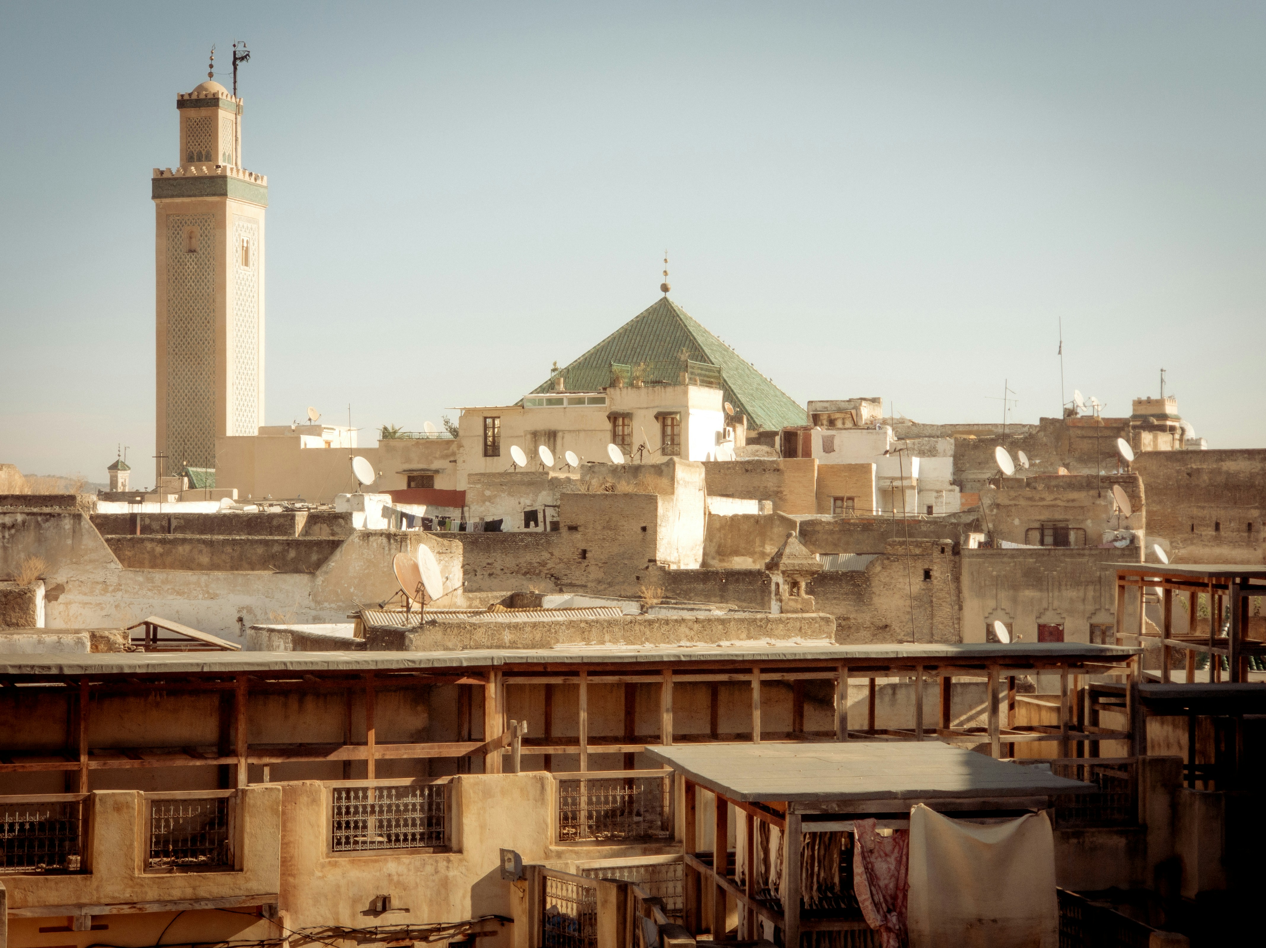 A view of a city from a rooftop of a building