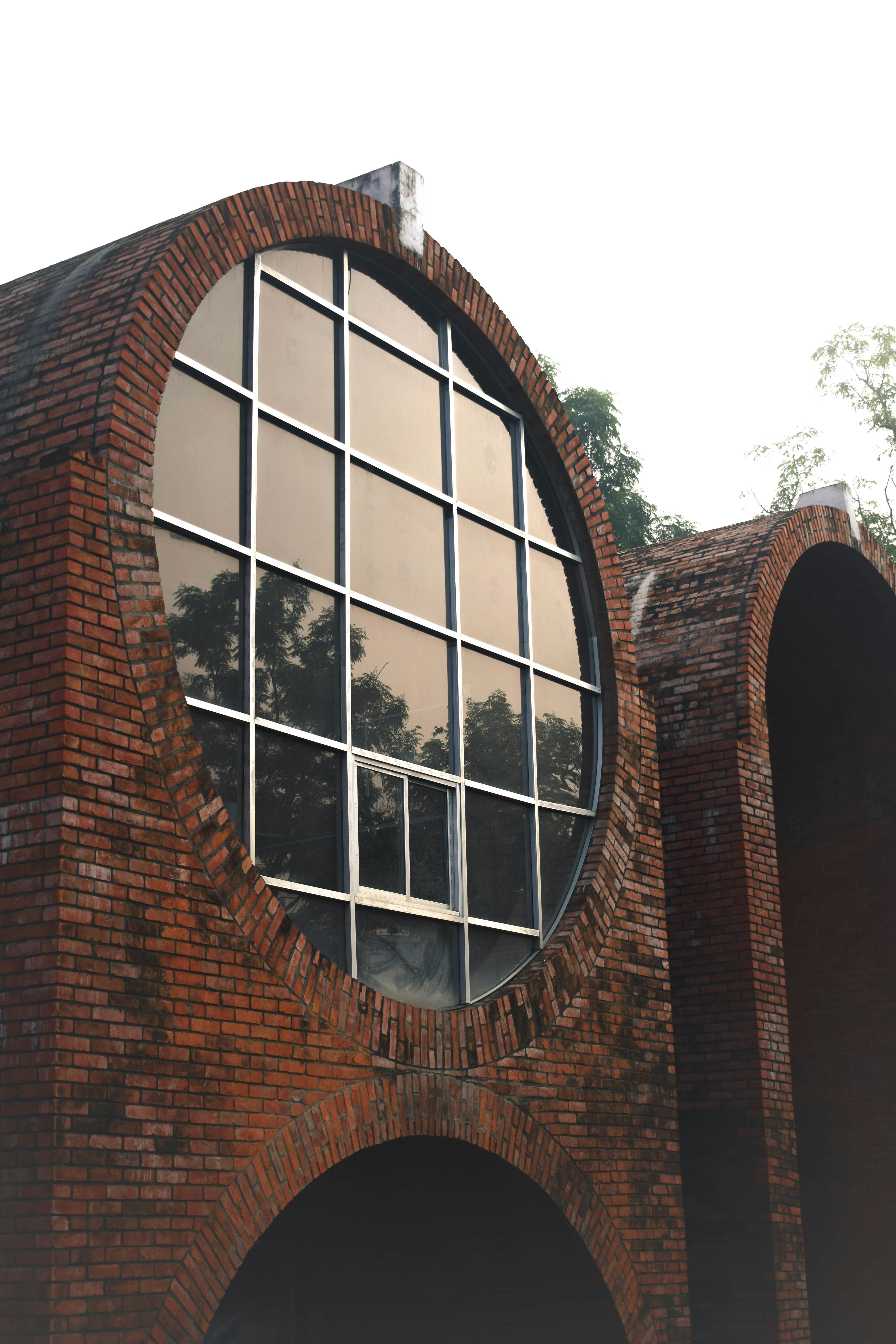 A large brick building with a circular window
