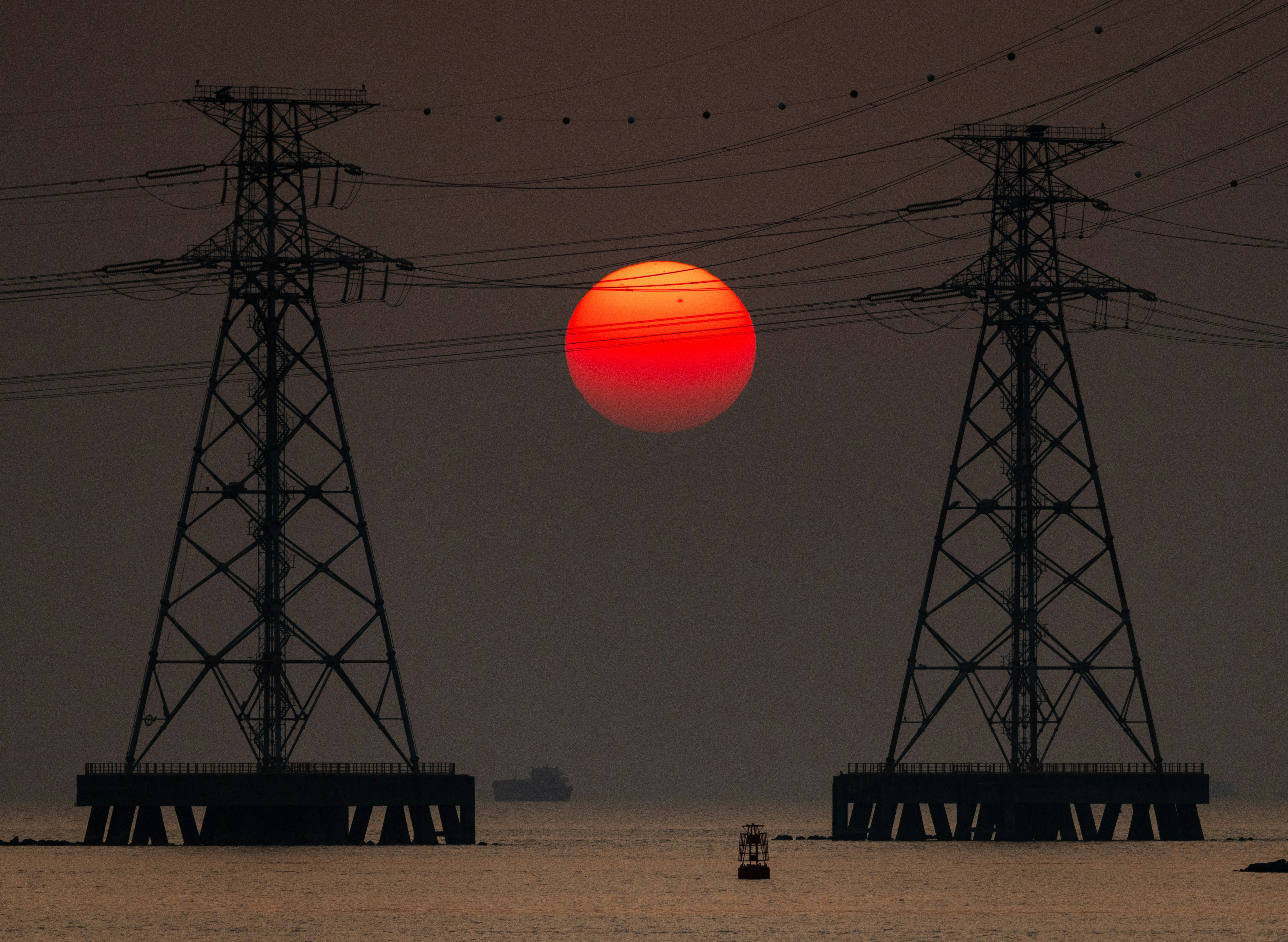 The sun is setting over a body of water