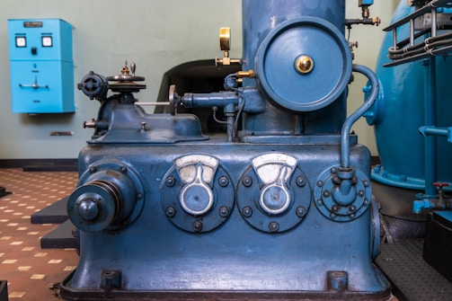 A large blue machine sitting inside of a building