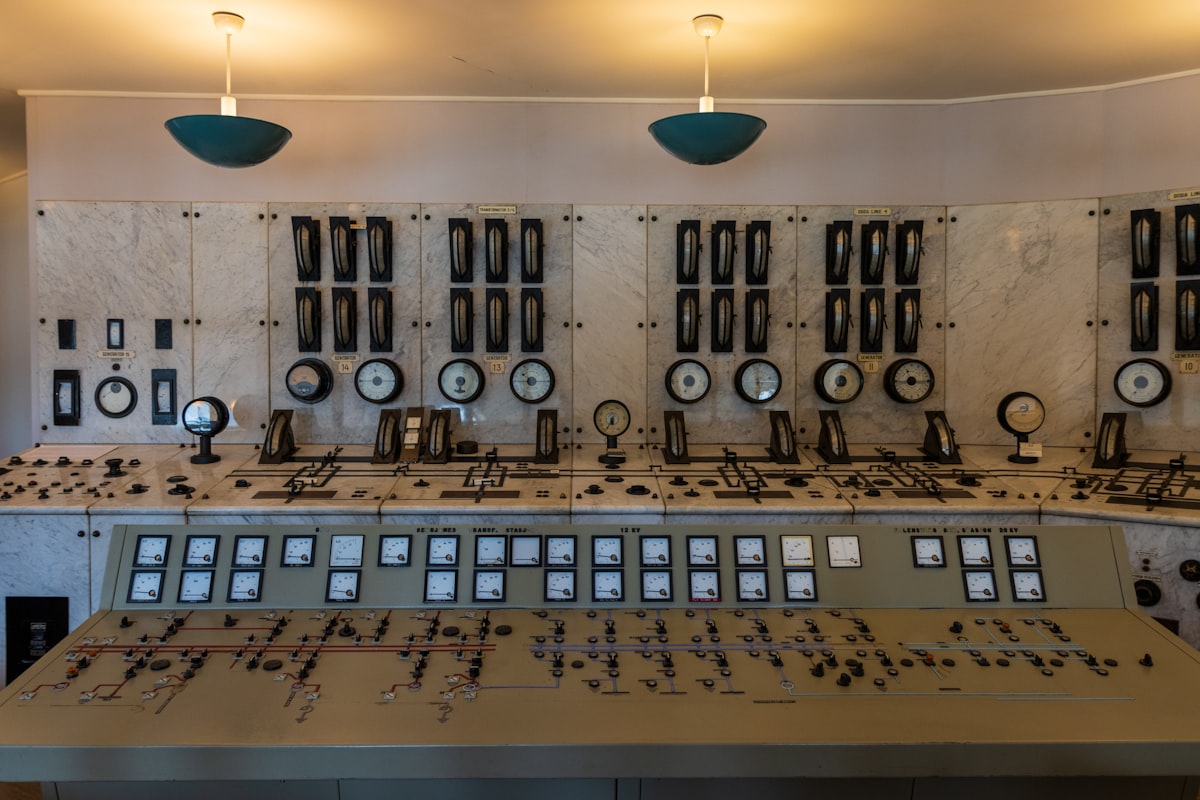 A large control room dense with precision control knobs