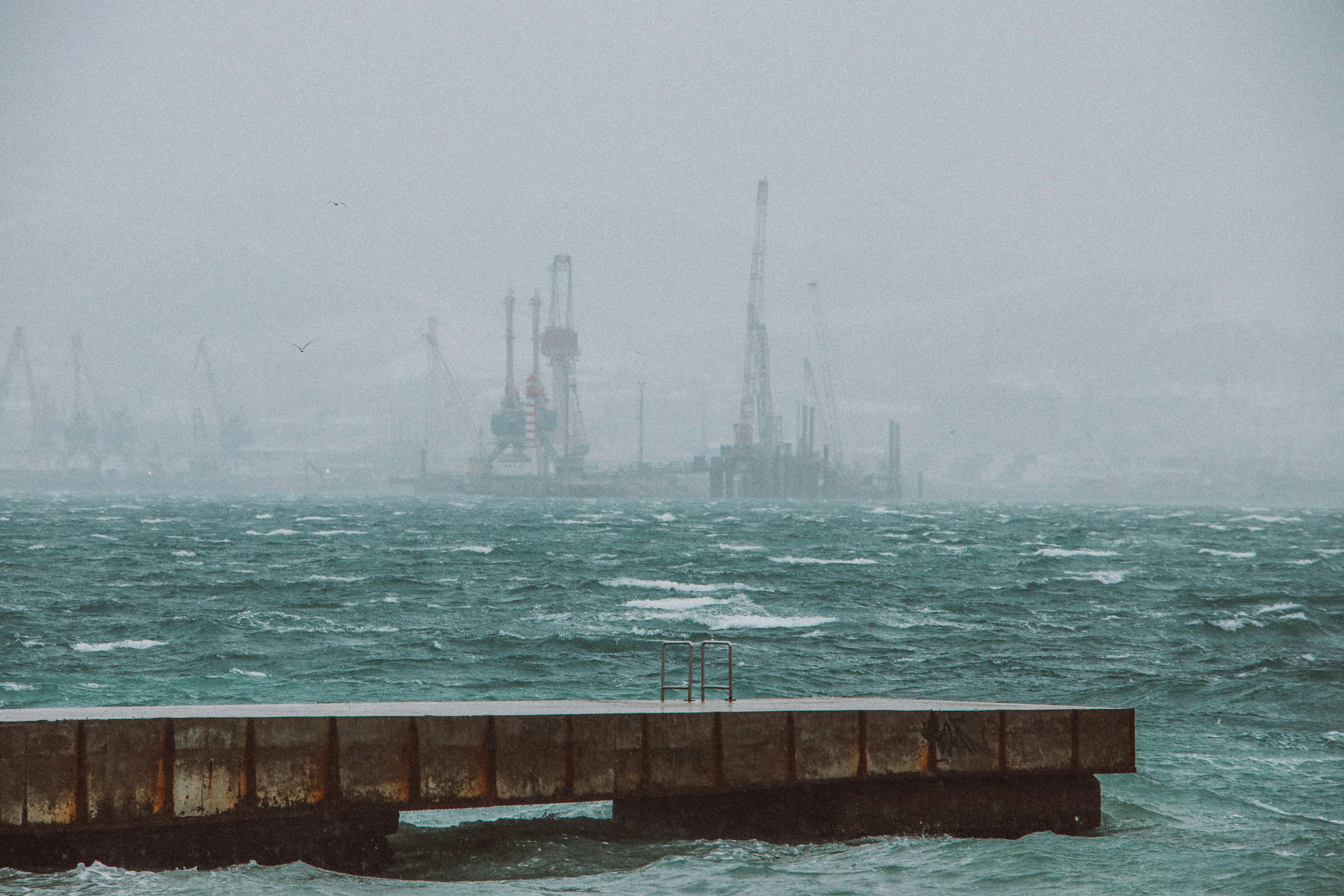 A pier in the middle of a body of water