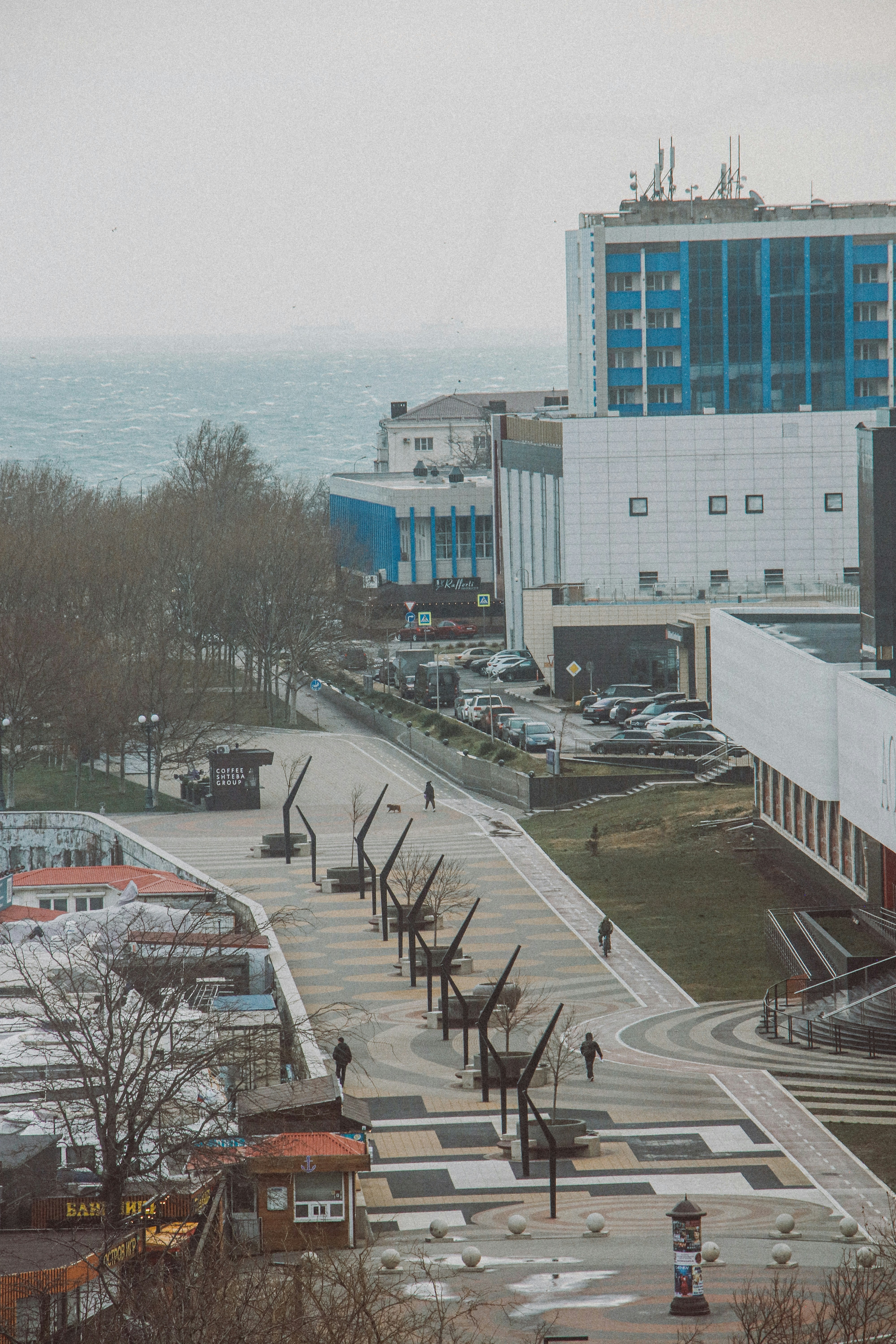 A view of a parking lot with a building in the background