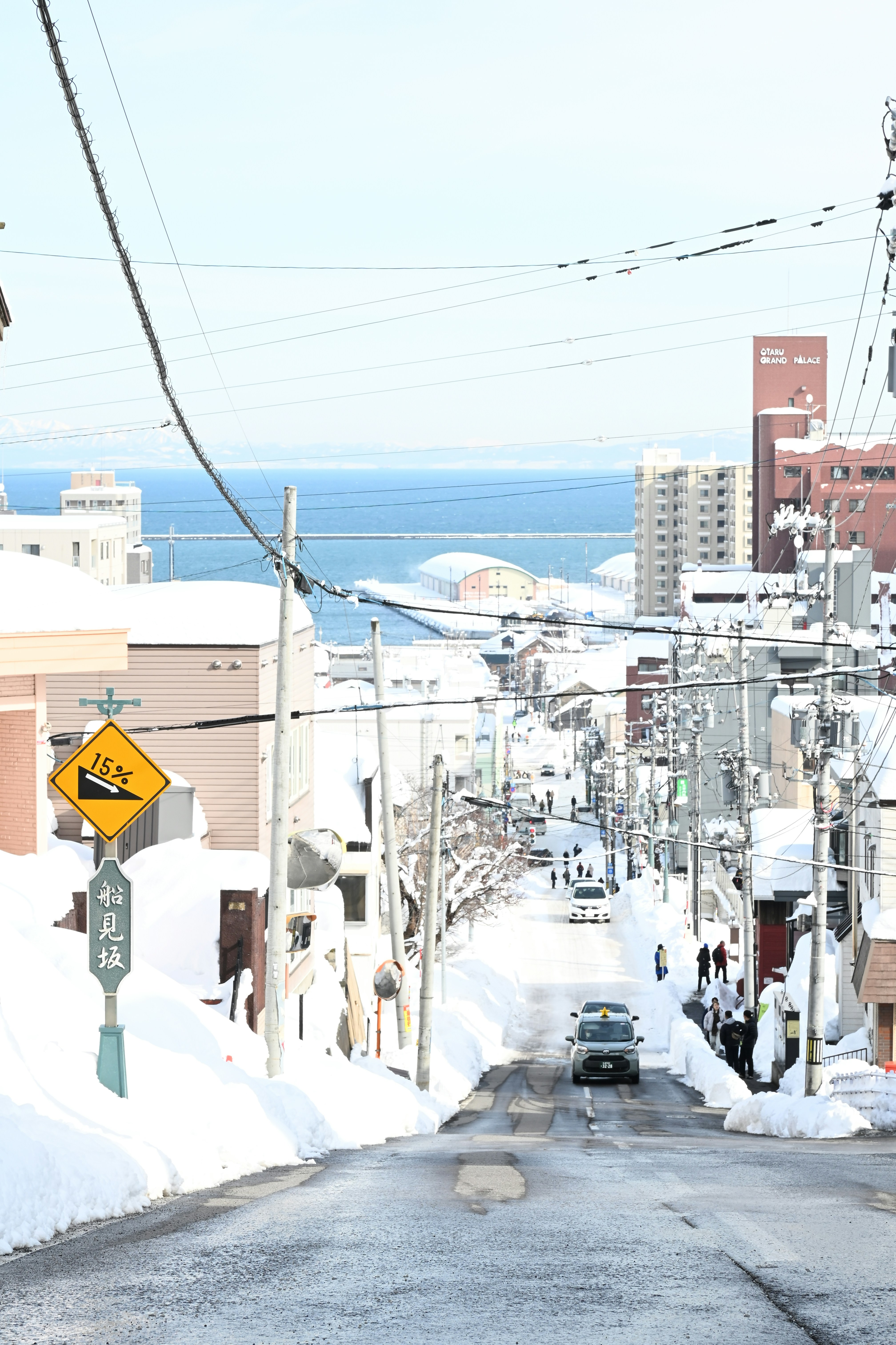 A car driving down a snow covered street