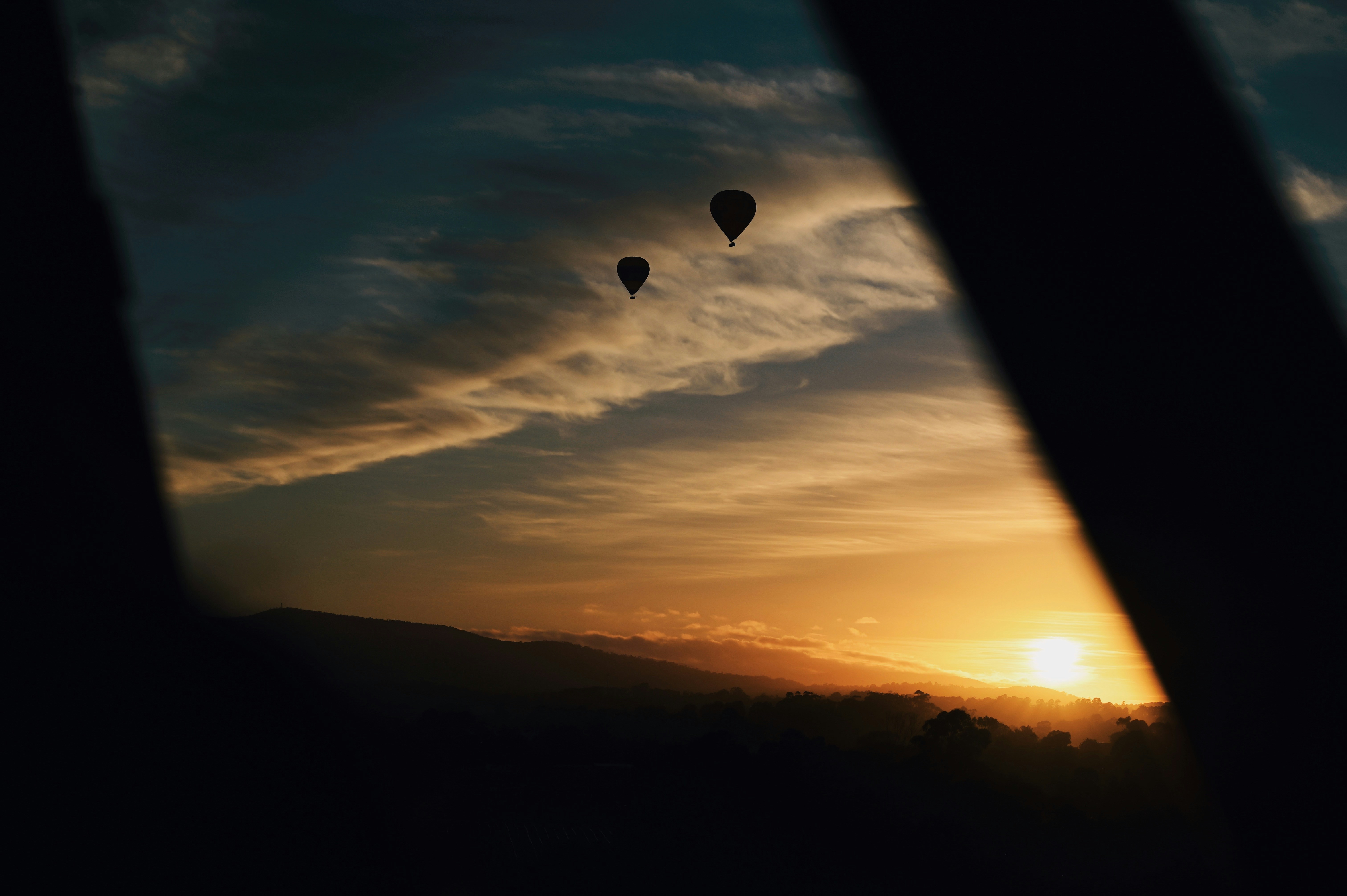A view of a sunset from inside a plane