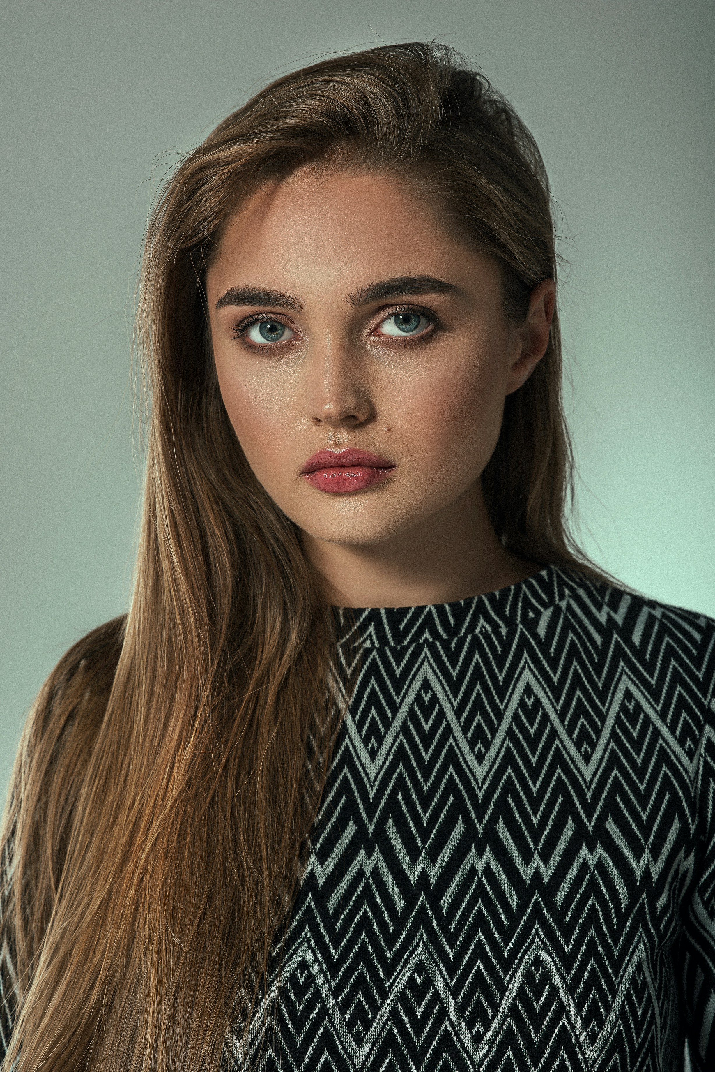 A woman with long hair and a black and white dress photo – Free ...