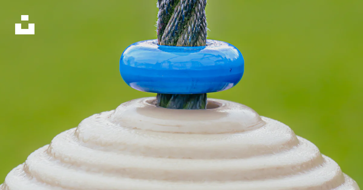 Fire Hydrant Rope A close up of a fire hydrant with a rope on top of it photo – Free ...