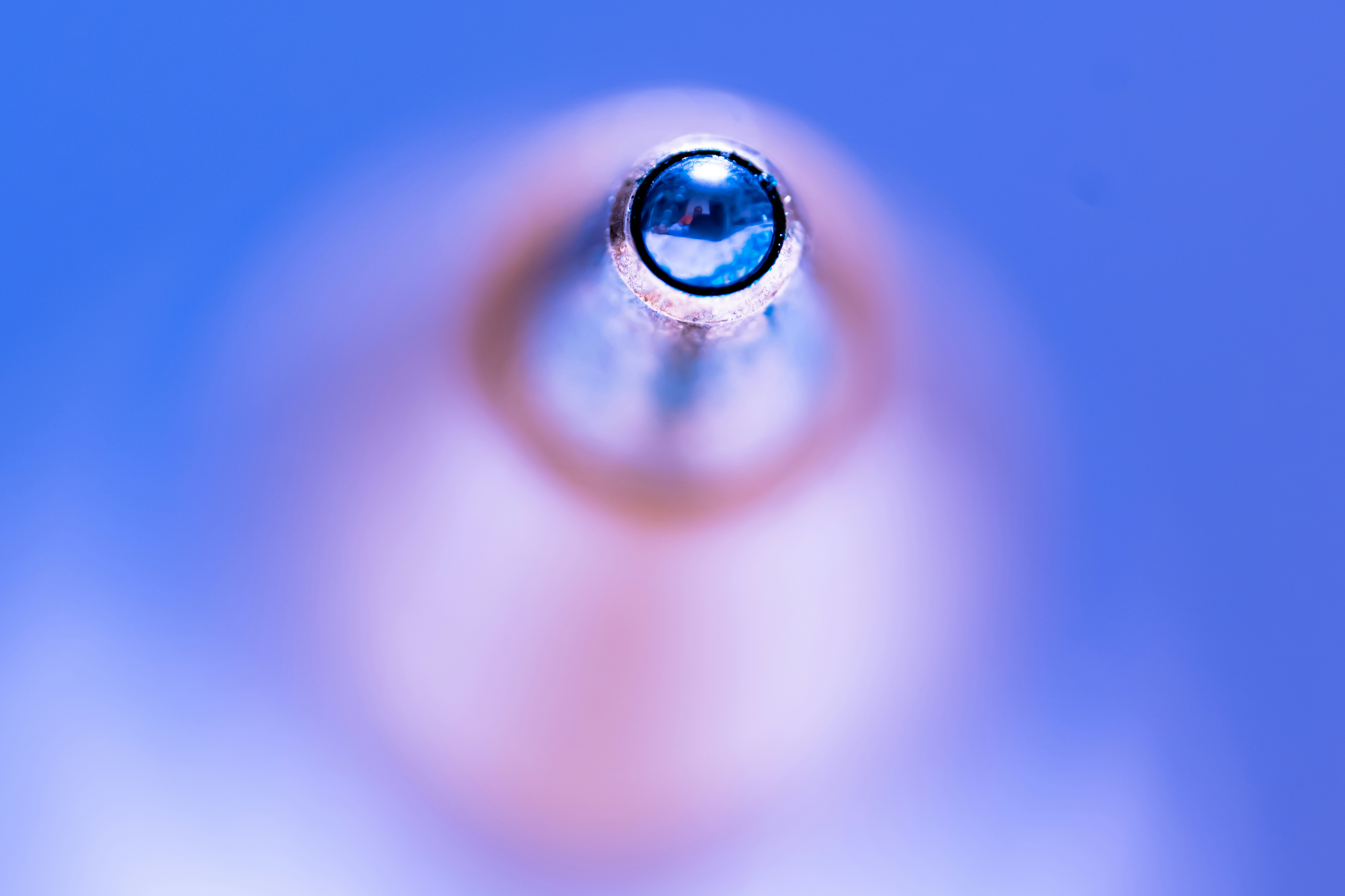 A drop of water with a blue background