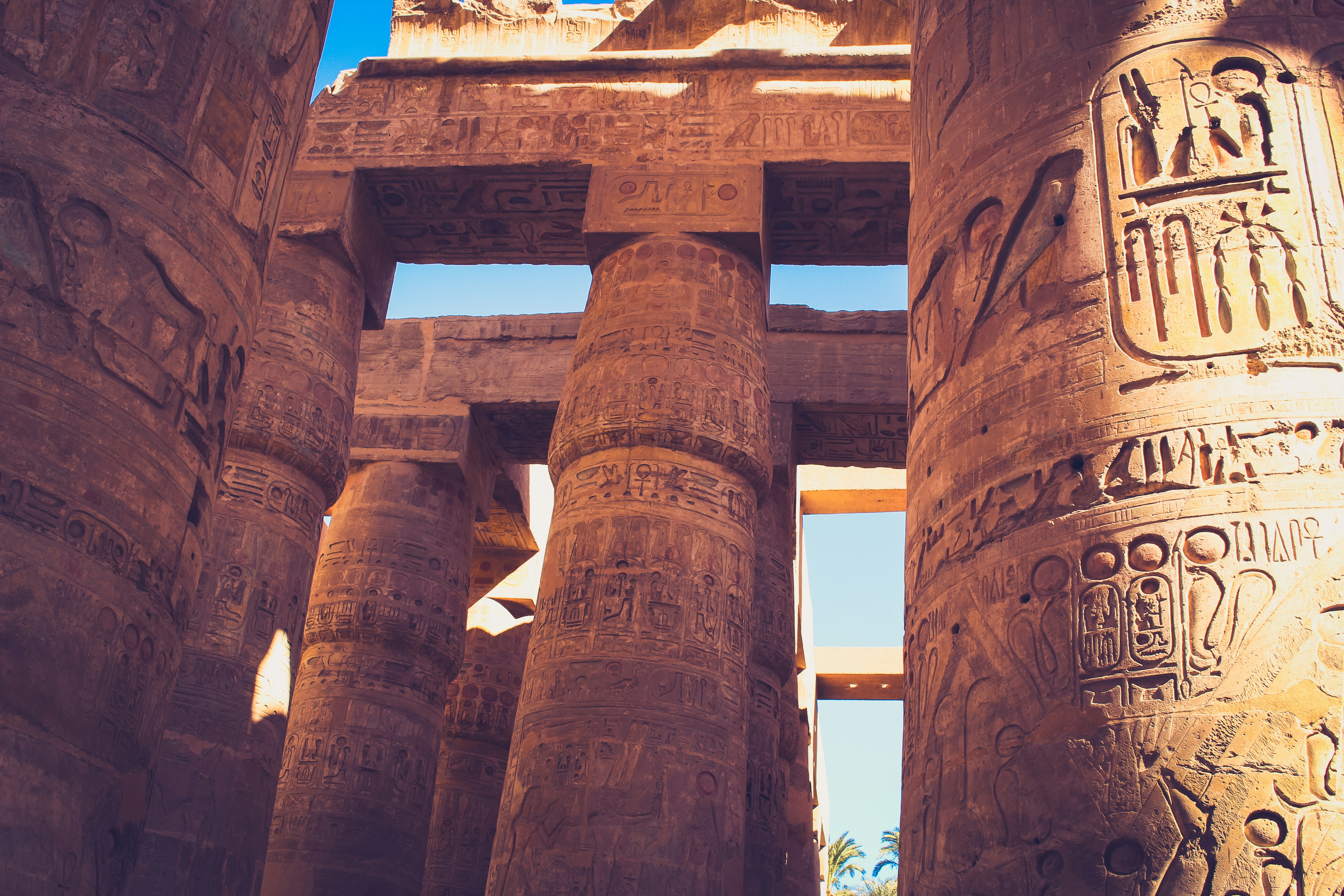 A close up of two large pillars with carvings on them
