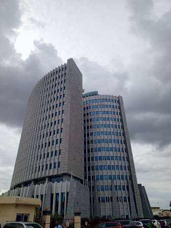 A very tall building sitting next to a parking lot