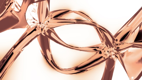 A close up of a metal object on a white background