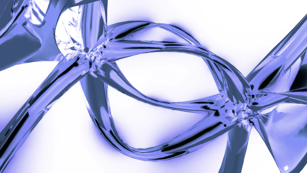 A close up of a pair of scissors on a white surface