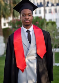 A man in a graduation gown and cap