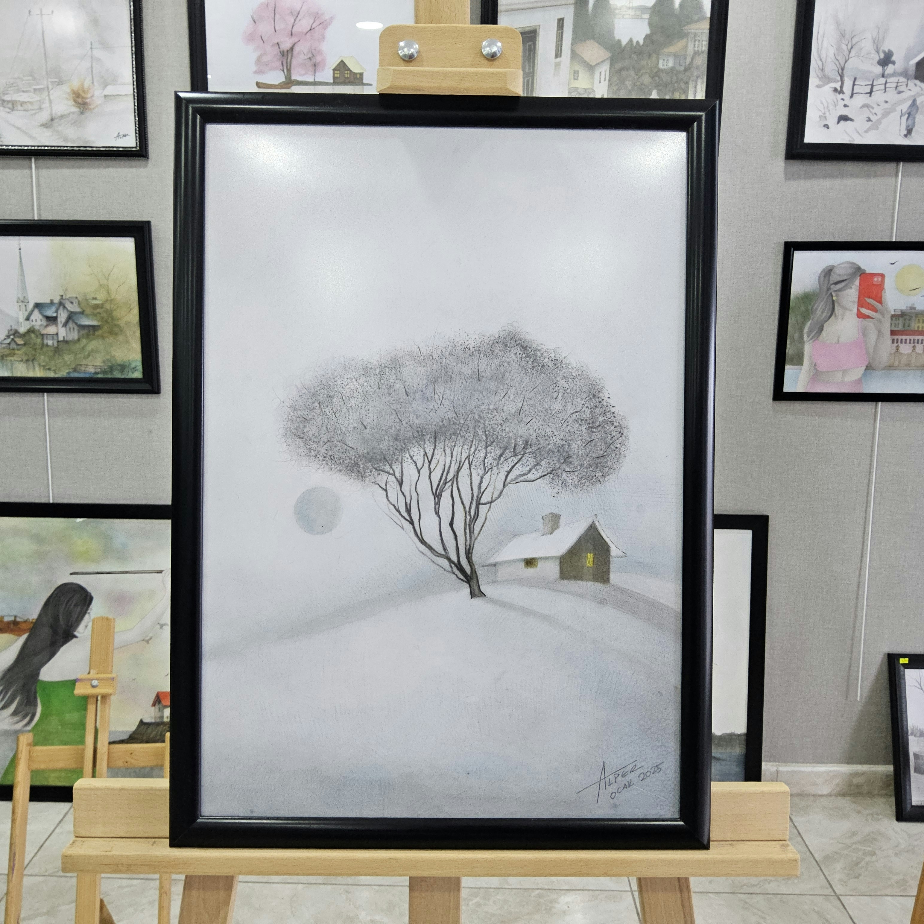 A picture of a tree in the snow