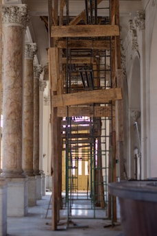 A very tall wooden structure in a big building