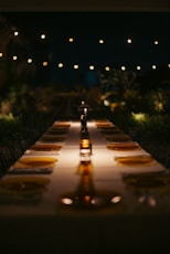 A long table with yellow plates on it