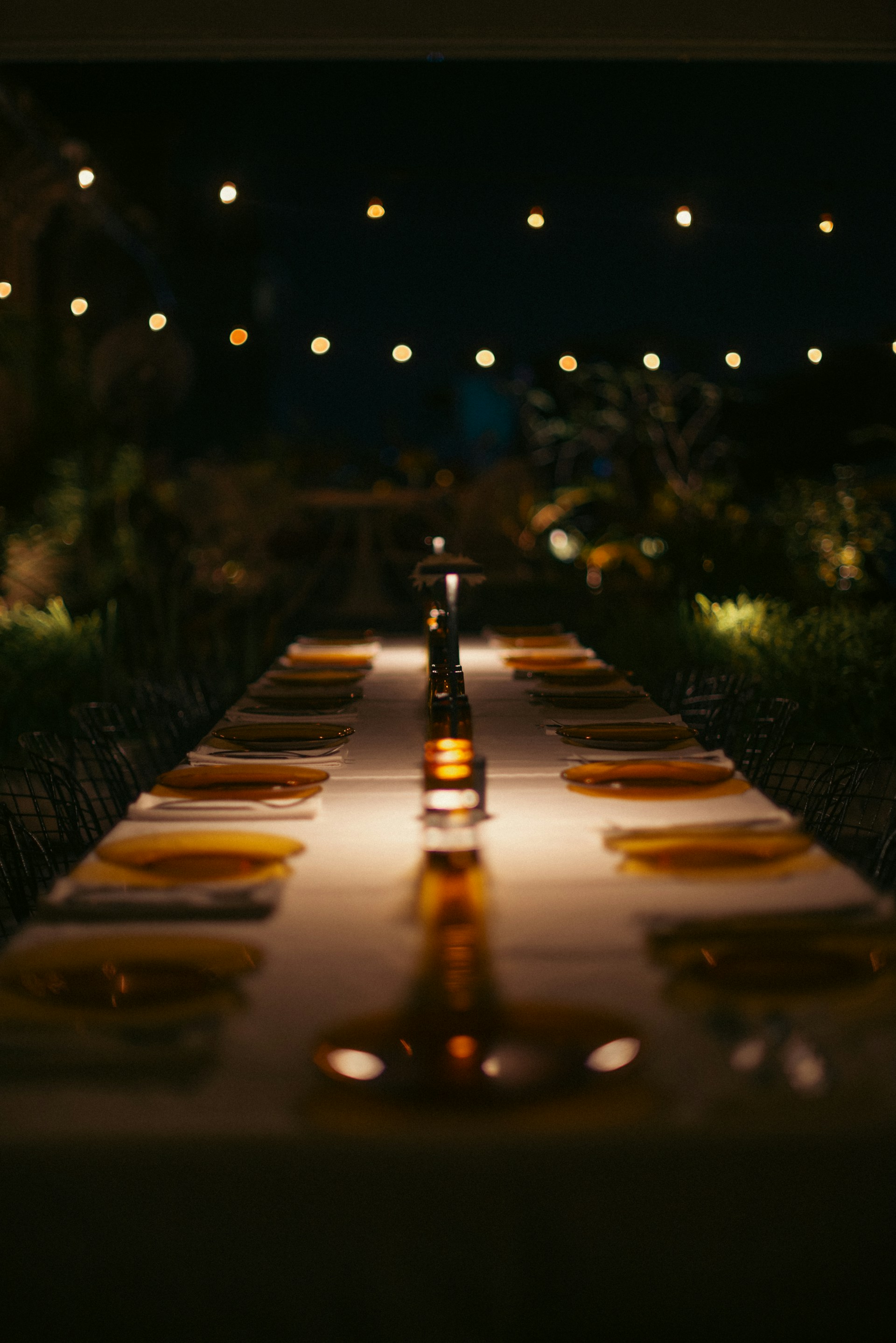 A long table with yellow plates on it