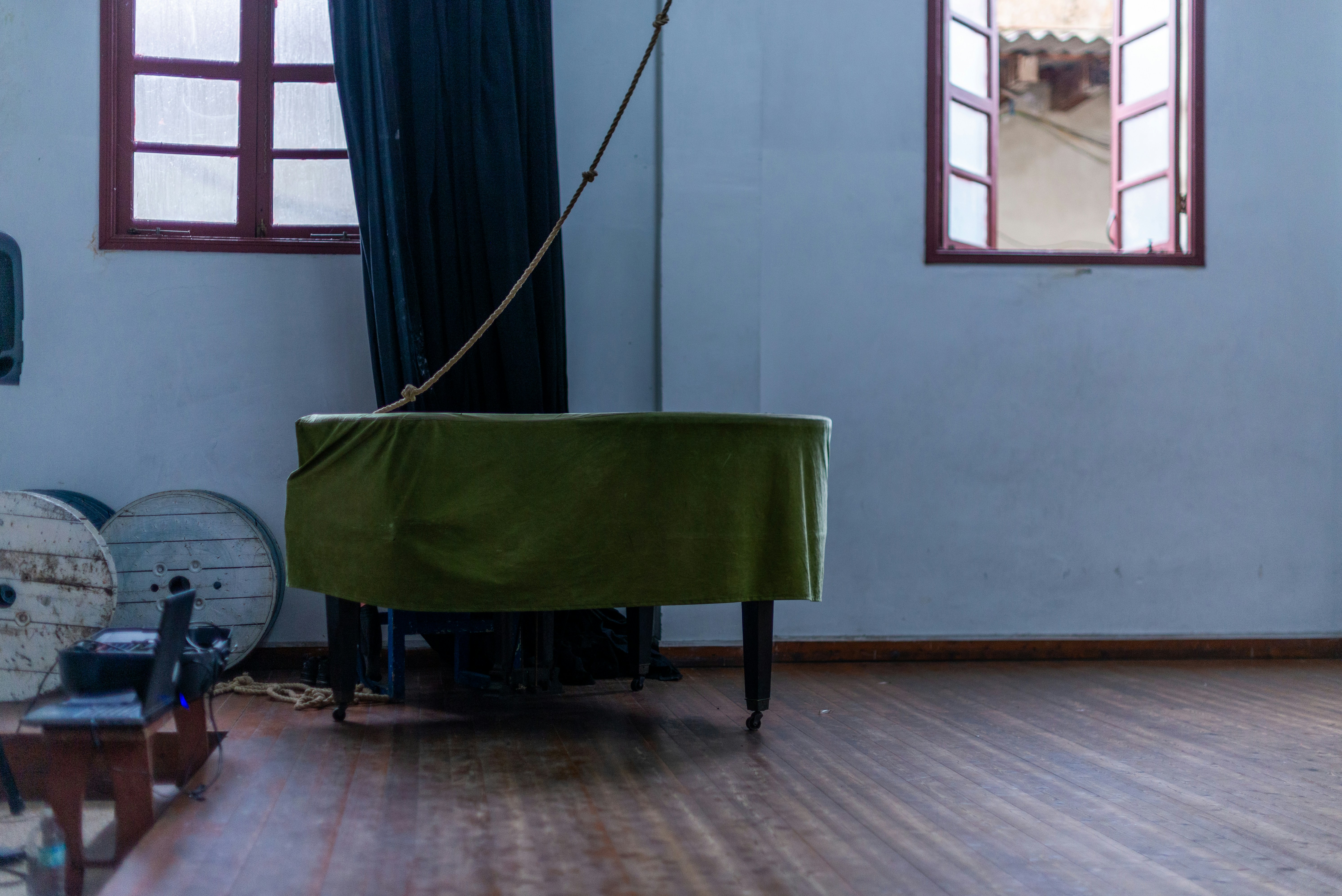 A room with a piano in the middle of it