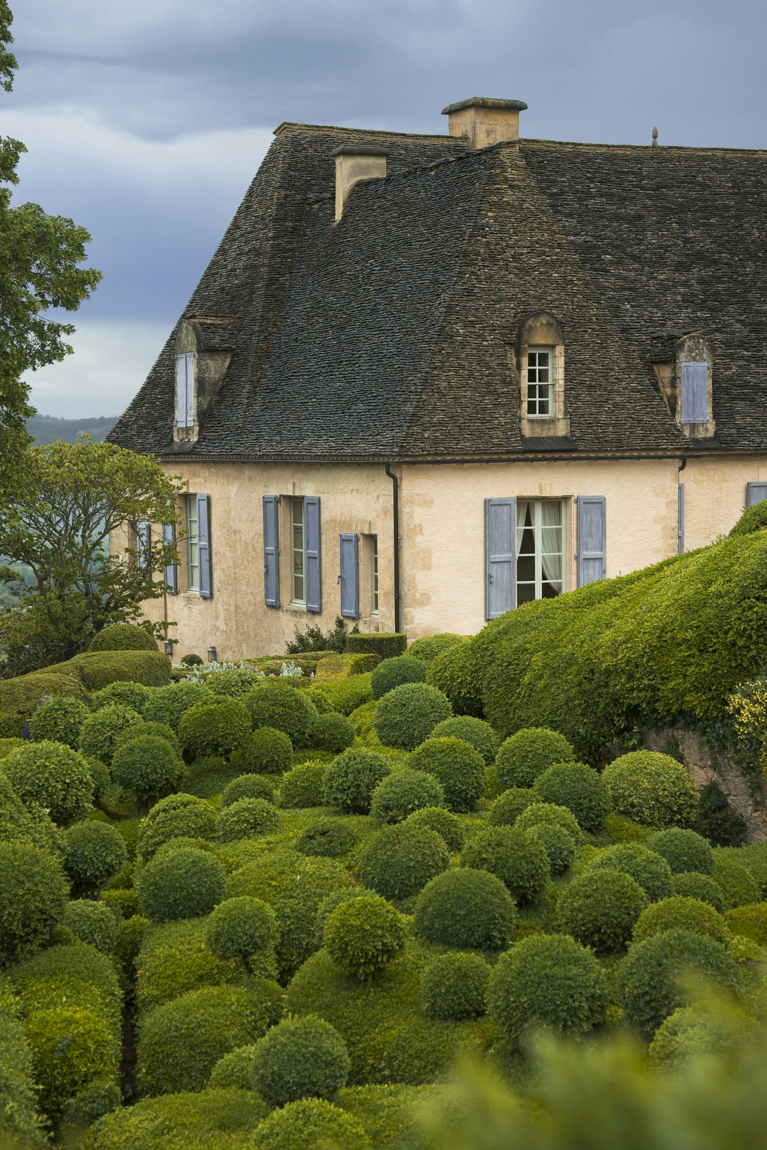 A house with a garden in front of it