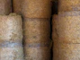 A bunch of hay rolls stacked on top of each other