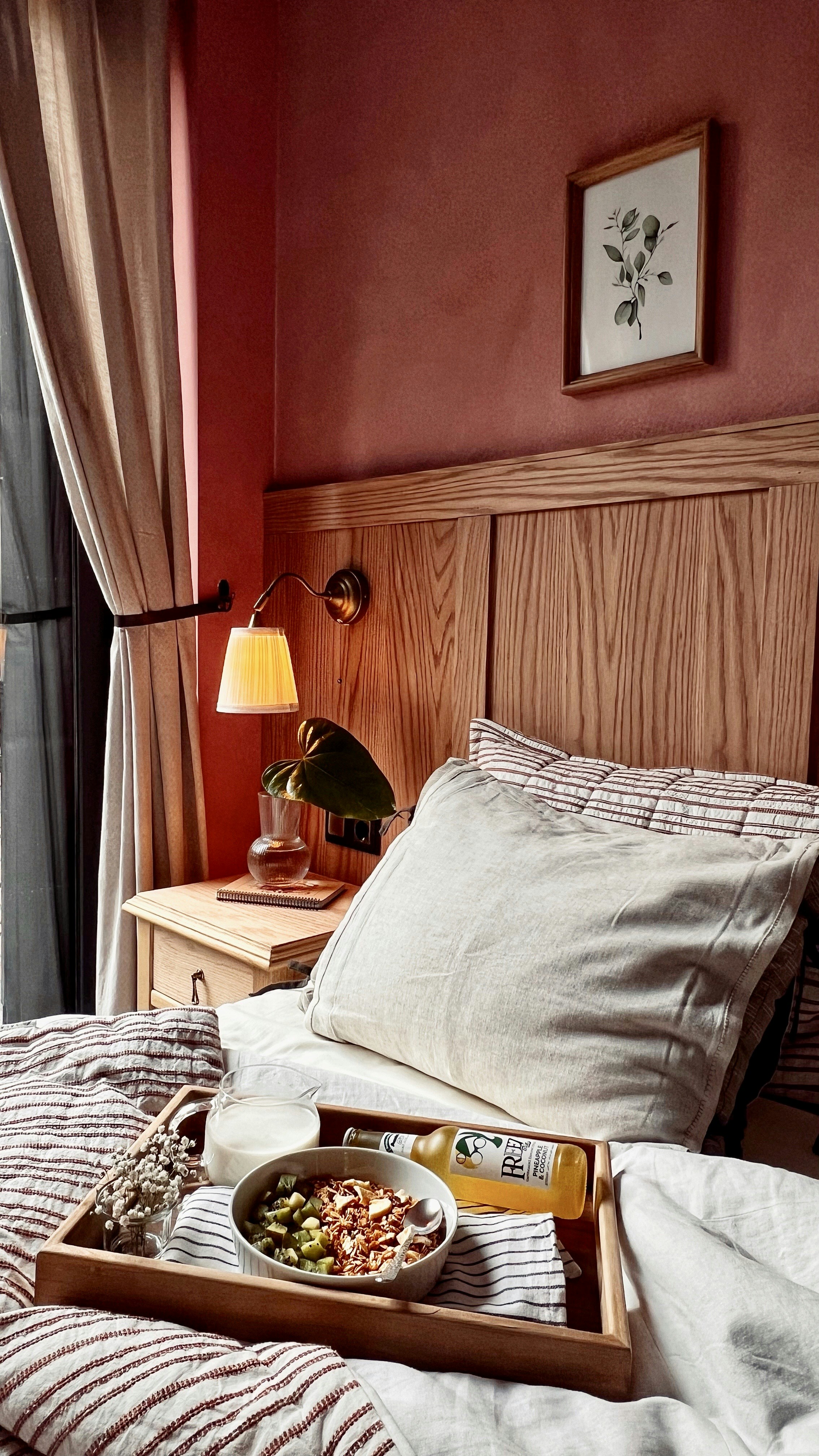 A bed with a tray of food on top of it