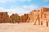 A group of adobe buildings in the desert