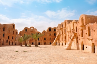 A group of adobe buildings in the desert