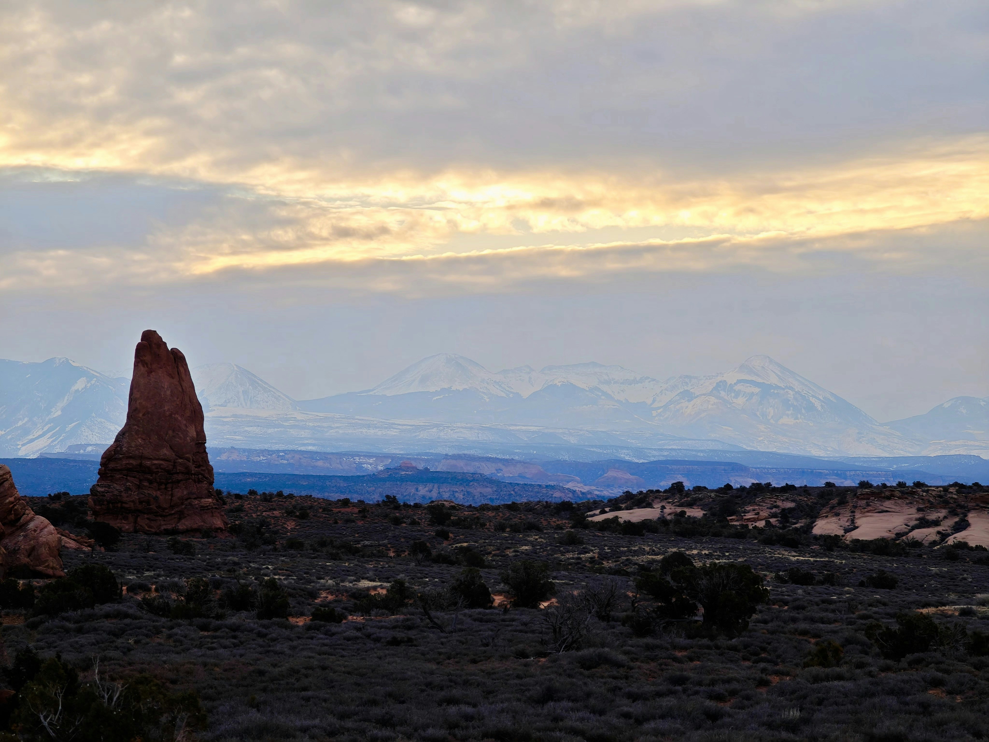 A large rock formation in the middle of a desert photo – Free Arches ...