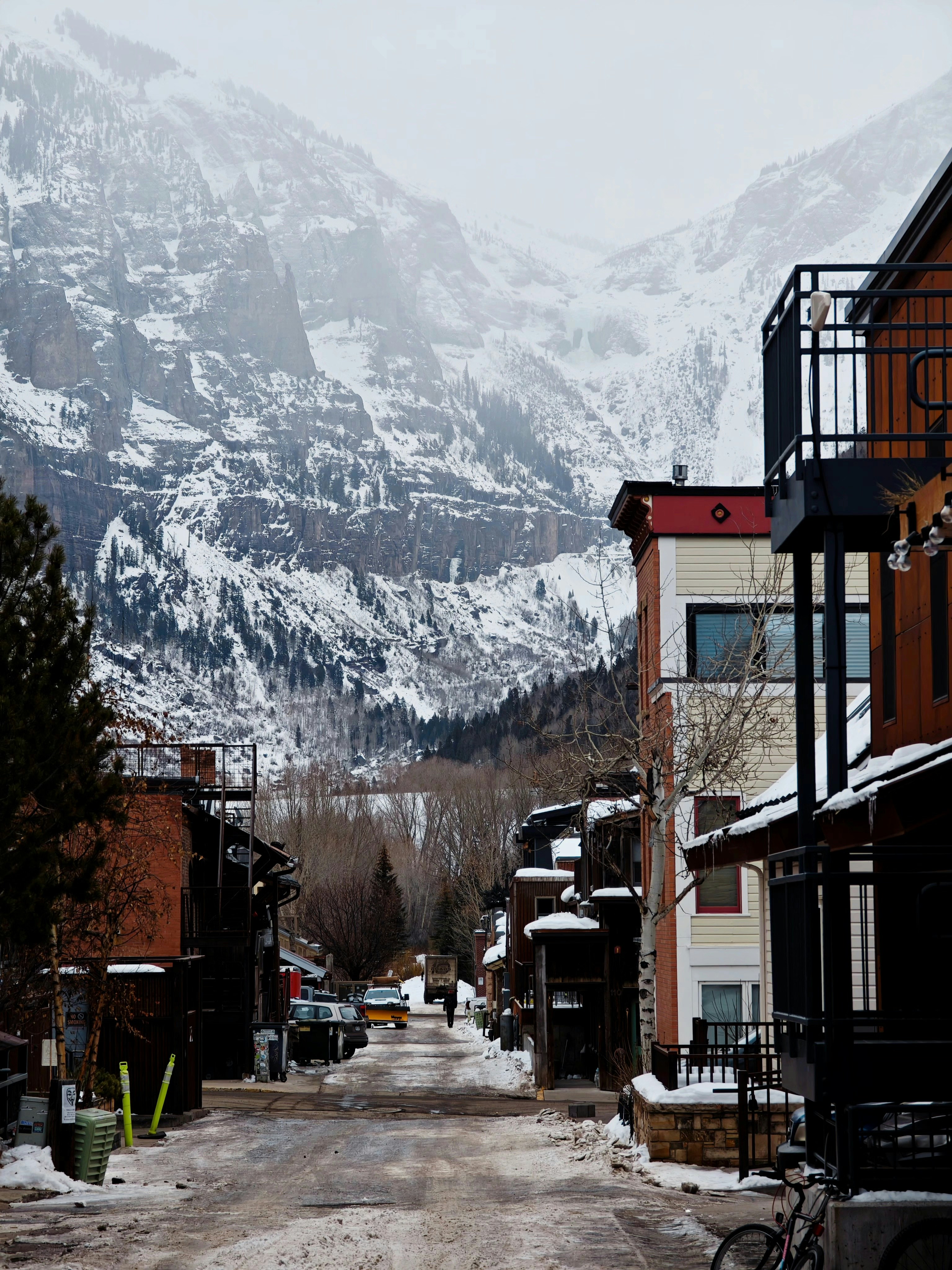 A snow covered mountain is in the distance