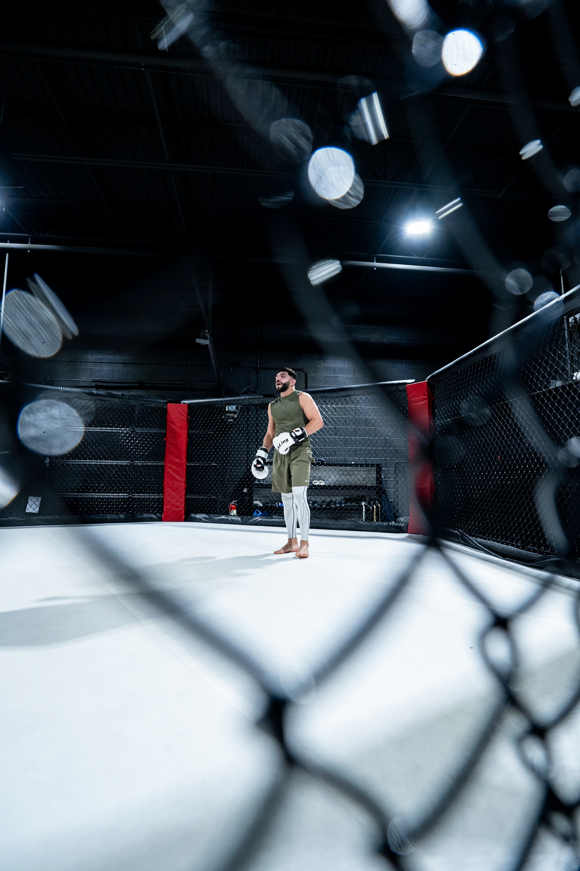 A man standing in the middle of a boxing ring