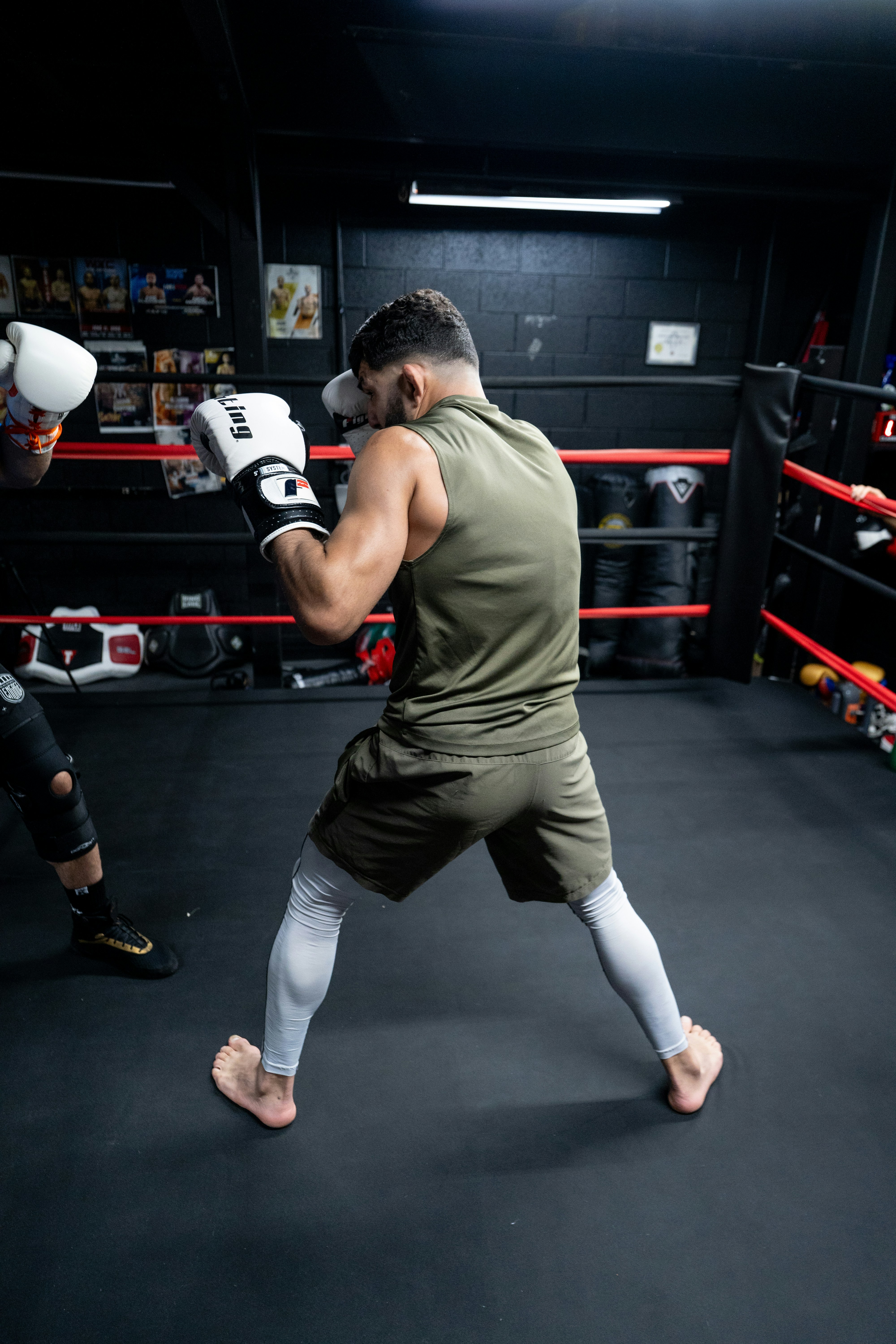 A couple of men standing in a boxing ring