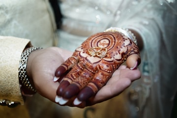 A close up of a person holding a hendi
