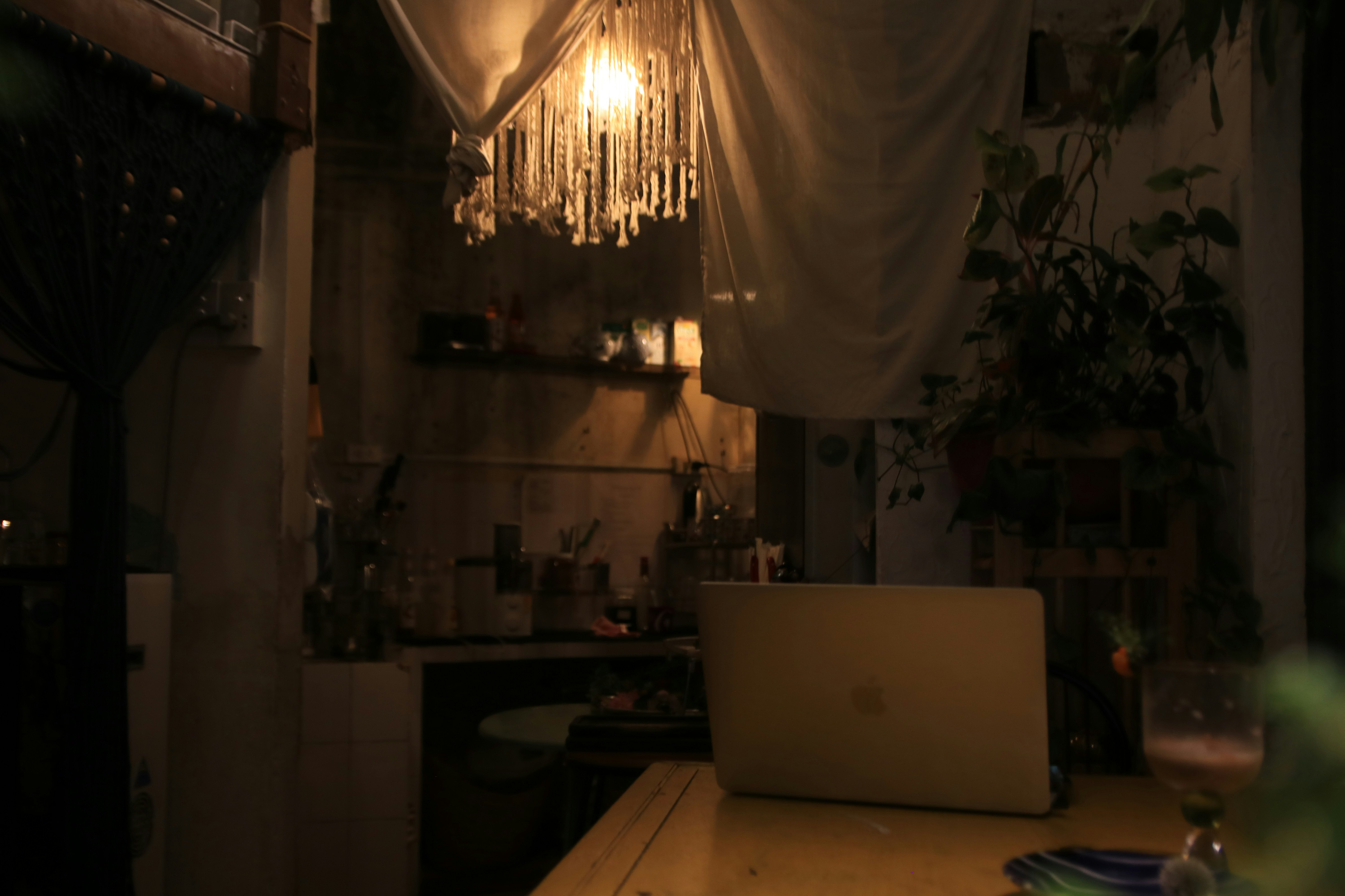 A laptop computer sitting on top of a wooden table
