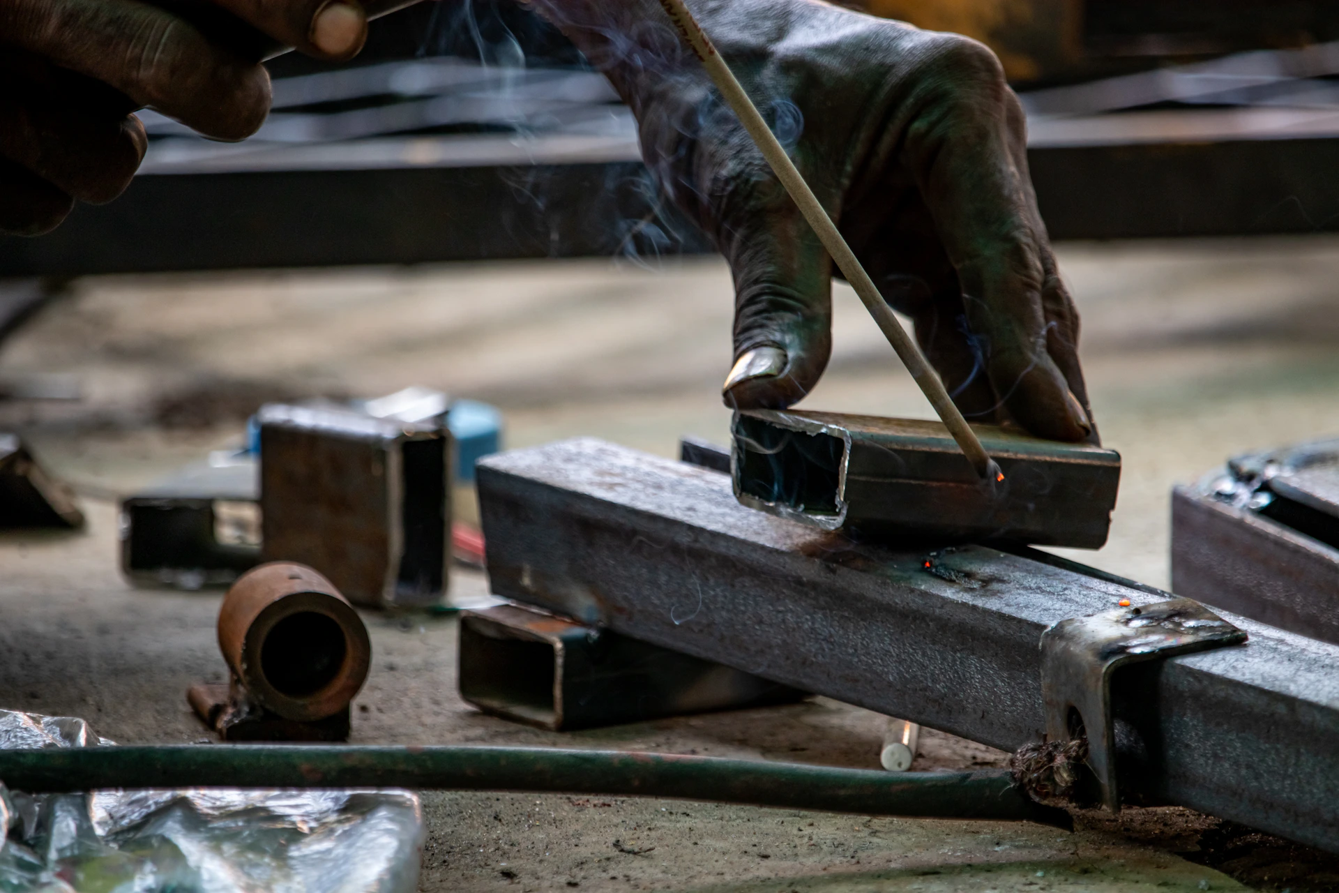 A person working on a piece of metal