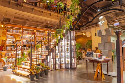 A room filled with lots of books and plants